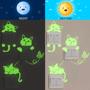 Luminous cat and butterfly wall decals showing glow effect in the dark and daytime view
