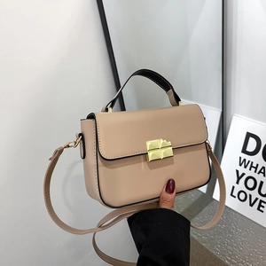 Retro beige leather crossbody bag with gold chocolate-shaped twist lock and top handle
