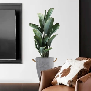 Moderne künstliche Paradiesvogelblume im grauen Zementtopf für Wohnzimmer Wanddeko