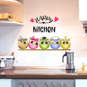 Colorful cartoon owls and Happy Kitchen wall decal shown on a white tiled kitchen backsplash