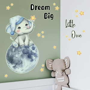 Close-up of elephant on blue moon wall sticker with Dream Big Little One text