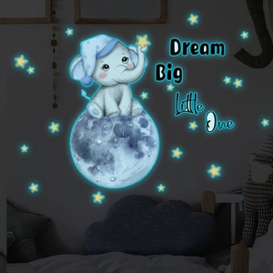 Glow-in-the-dark baby elephant sitting on the moon wall decal with blue stars and quote