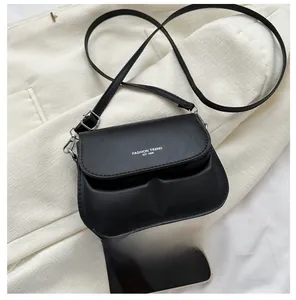 Mini black matte leather crossbody bag with letter print and mobile phone size comparison