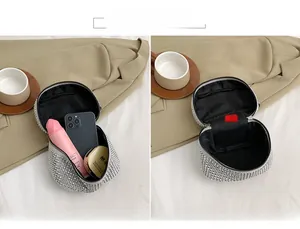 Internal view of the sparkling silver rhinestone bag showing storage space for makeup and phone