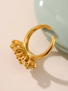 Detailed view of 18K gold plated coral-inspired open ring with zircon stone inlay