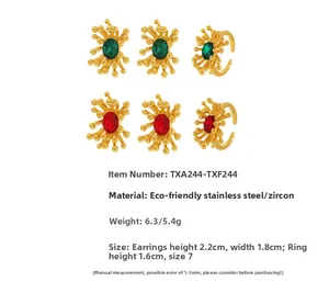 Detail view of 18K gold stainless steel jewelry set with red and green zircon stones