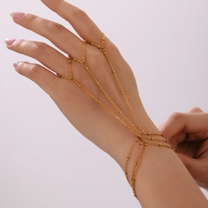 Gold plated stainless steel slave bracelet with small beads and multi-finger ring chains