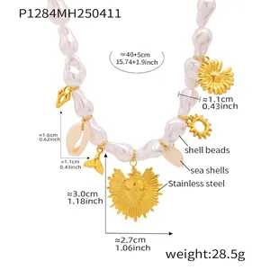 Detail of beaded shell necklace with gold heart charms and beach-themed pendants