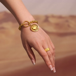 Gold stainless steel thick chain OT bracelet with round coin pendant on wrist