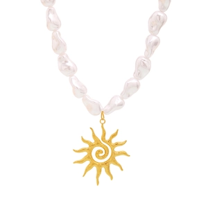Baroque pearl necklace featuring a large golden sun pendant in a summer beach style