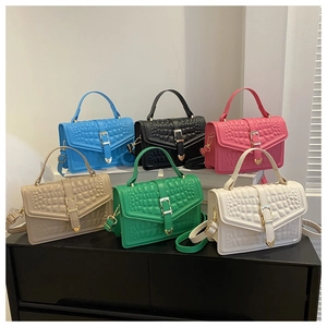 Detailed arrangement of six faux crocodile leather handbags in various elegant colors