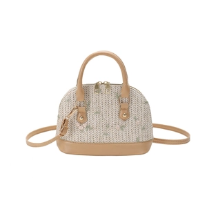Woven shell-shaped handbag with floral embroidery and brown leather straps for women