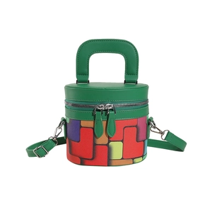 Green cylindrical bucket bag with colorful geometric patterns and adjustable strap