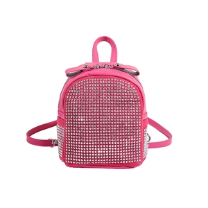 Sparkly rose pink mini backpack with silver rhinestones and a chic leather bow decoration