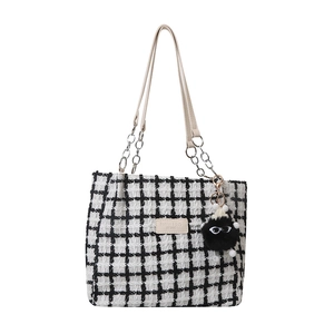 Checkerboard pattern tote bag with leather chain strap and cute plush monster charm