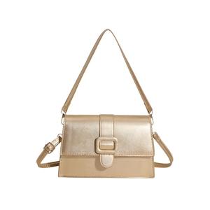 Elegant gold patent leather square handbag with metallic flap and adjustable strap