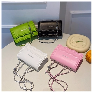 Wavy edge crossbody bags in green, black, white, and pink with metal chain straps