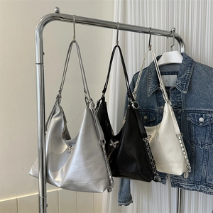 Three PU leather hobo bags in silver, black and white with metal butterfly buckles