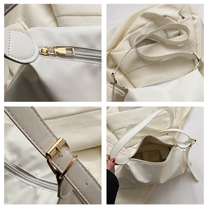 Detail view showing smooth white PU leather texture and premium gold metal hardware on bag