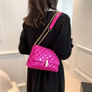 Magenta quilted faux leather crossbody bag with gold chain and metal twist lock