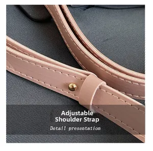Close-up of pink leather strap with gold sphere adjuster and fine stitching details