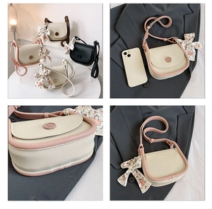 Detail view of mini saddle bag with contrast printed scarf and embossed F letter buckle
