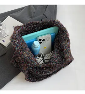 Spacious interior of soft glittery knit tote bag holding tablet and daily essentials
