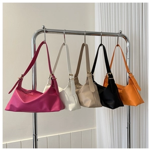 Five colored minimalist hobo bags with adjustable shoulder straps and gold hardware detail