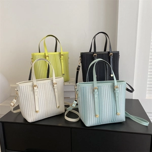 Minimalist vertical stripe bucket bags in neon green, black, white, and light blue colors