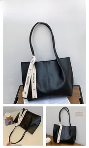 Detailed views of a black PU leather tote bag with a decorative white fashion ribbon