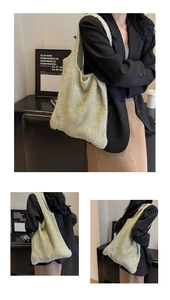 Detailed view of the woven texture and soft golden knit fabric on this shoulder tote bag