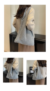 Detailed view of silver knitted tote bag with metallic texture and woven grain finish