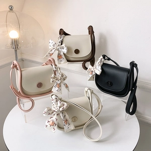 Elegant saddle shoulder bags with contrast trim and silk bow scarves in four colorways