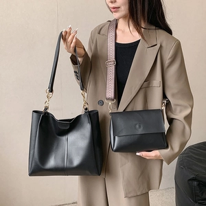 Chic black tote bag set with metal chain handle and geometric pattern shoulder strap
