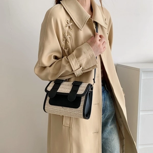 Retro straw crossbody bag with black leather trim shown from a side view on a model