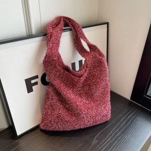 Sparkling red knit tote bag with metallic threads and integrated dual handle design