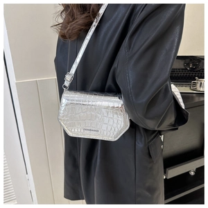 Silver crocodile pattern shoulder bag with metallic finish and adjustable strap