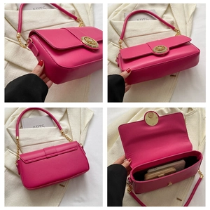 Detail view of pink rectangular shoulder bag with golden lock and spacious interior