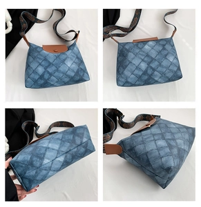 Detailansicht der Vintage-Tragetasche mit blauem Karomuster und braunem Lederbesatz