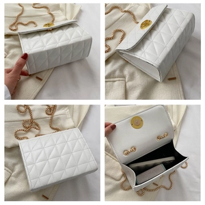 Détails d'un sac bandoulière matelassé blanc montrant la bandoulière et l'espace interne