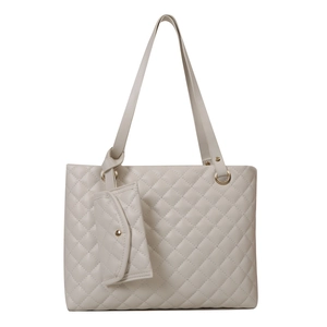 Minimalist beige quilted tote bag with golden hardware and matching coin purse charm