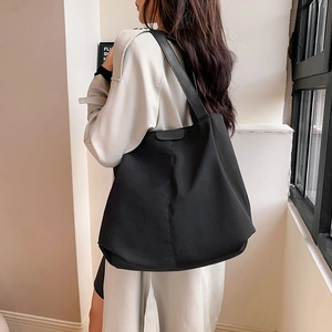 Minimalist black large capacity canvas tote bag with leather patch for women
