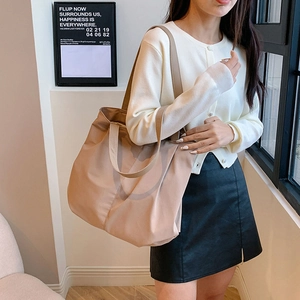 Large capacity beige canvas tote bag with dual shoulder straps for casual commuting