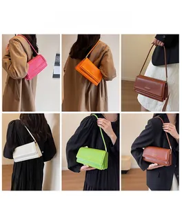 Multiple colors of minimalist shoulder bags shown on models in a clean interior setting