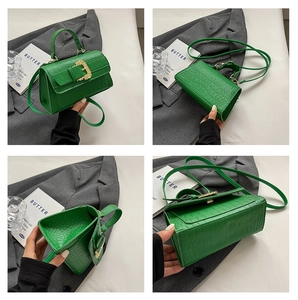 Detailed views of a dark green crocodile pattern handbag with a vintage gold buckle