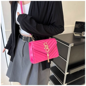 Hot pink quilted PU leather bag detail with gold SSS metal hardware and tassel charm