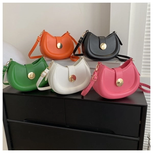 Collection of minimalist saddle bags in five colors with round gold buckles and smooth leather
