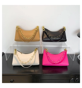 Detailed view of multi-color crocodile texture hobo bags with decorative chunky chain links