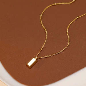 Minimalist gold bar pendant necklace with satellite bead chain in polished titanium steel