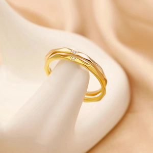 Polished titanium steel faceted rings in gold and rose gold with tiny diamonds